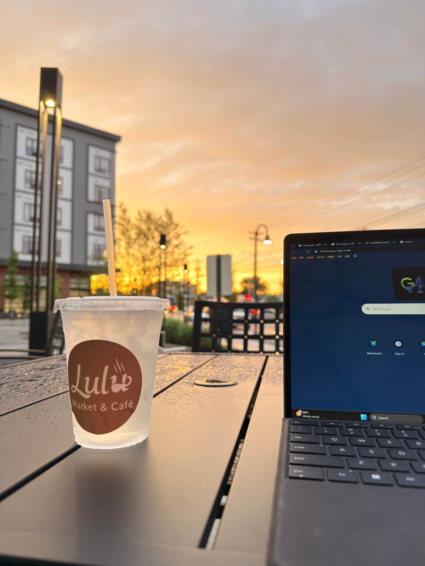 Working at Lulu with a Lulu drink at sunset